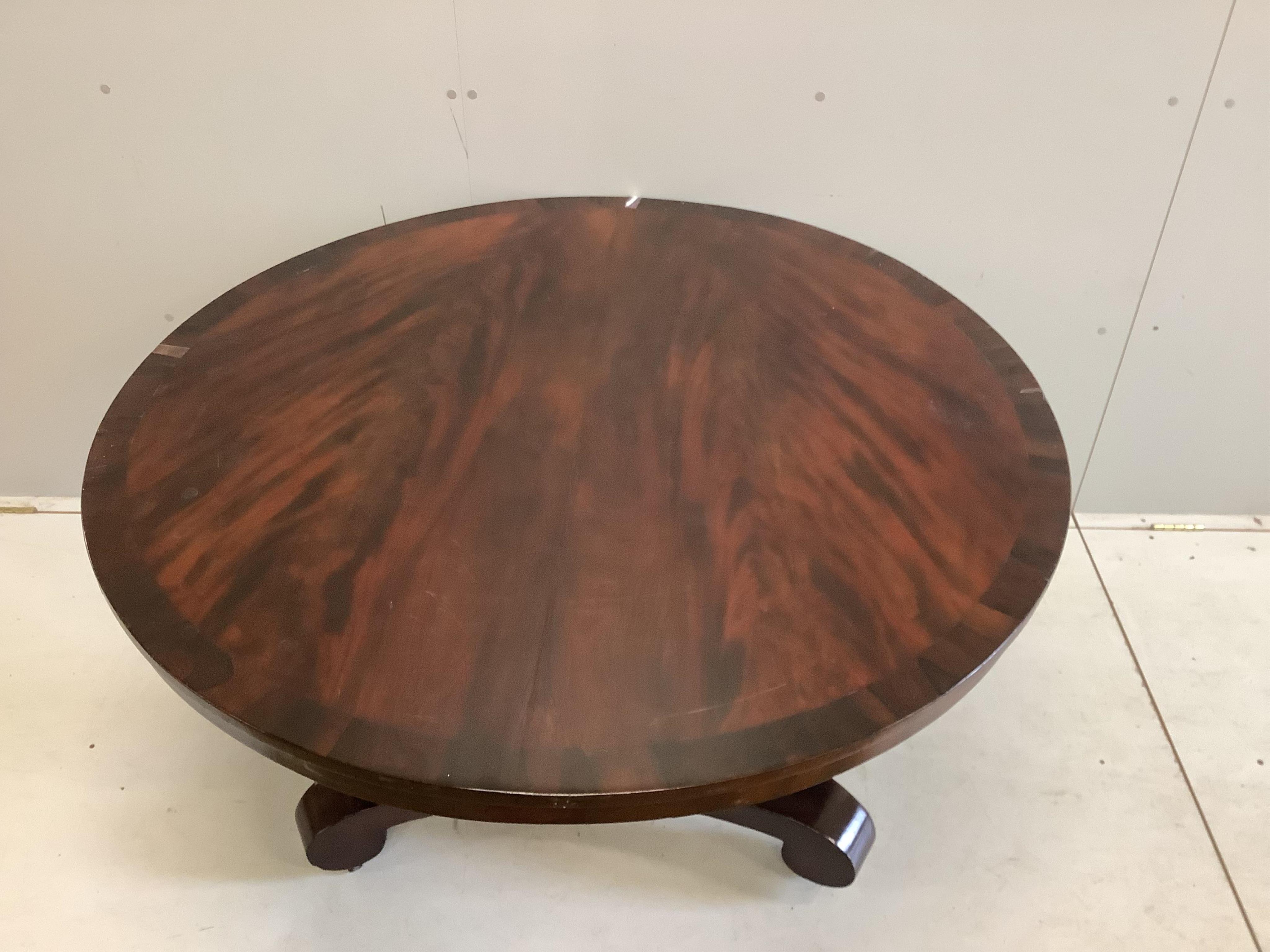 An early Victorian mahogany tilt top breakfast table, diameter 124cm, height 72cm. Condition poor to fair.